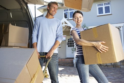Professional movers protecting furniture during a Waterloo relocation