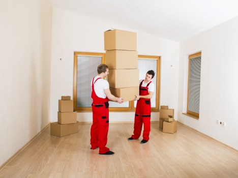 Boxes and furniture being assessed by volume for a removals estimate